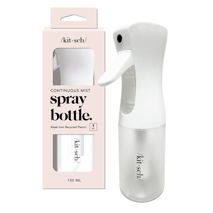 White recycled plastic continuous spray bottle with a compact cylindrical body.