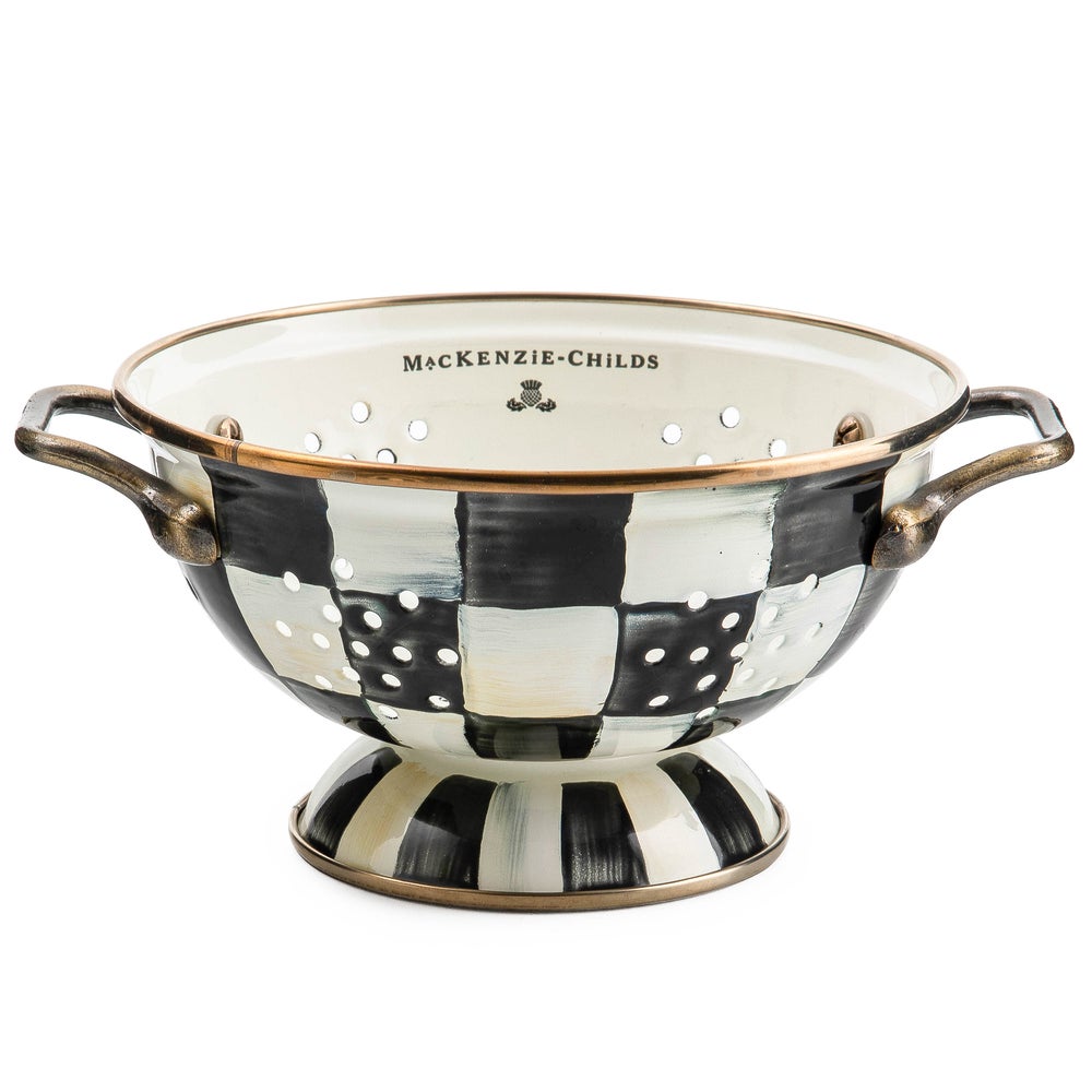 Small Courtly Check enamel colander with hand-painted black and white checks and brass handles.