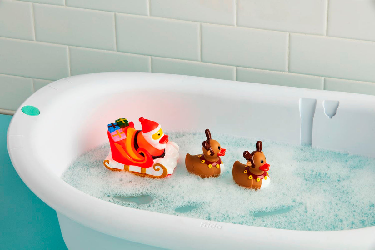 Santa Claus bath toy set with rubber reindeer figures in red and green colors.