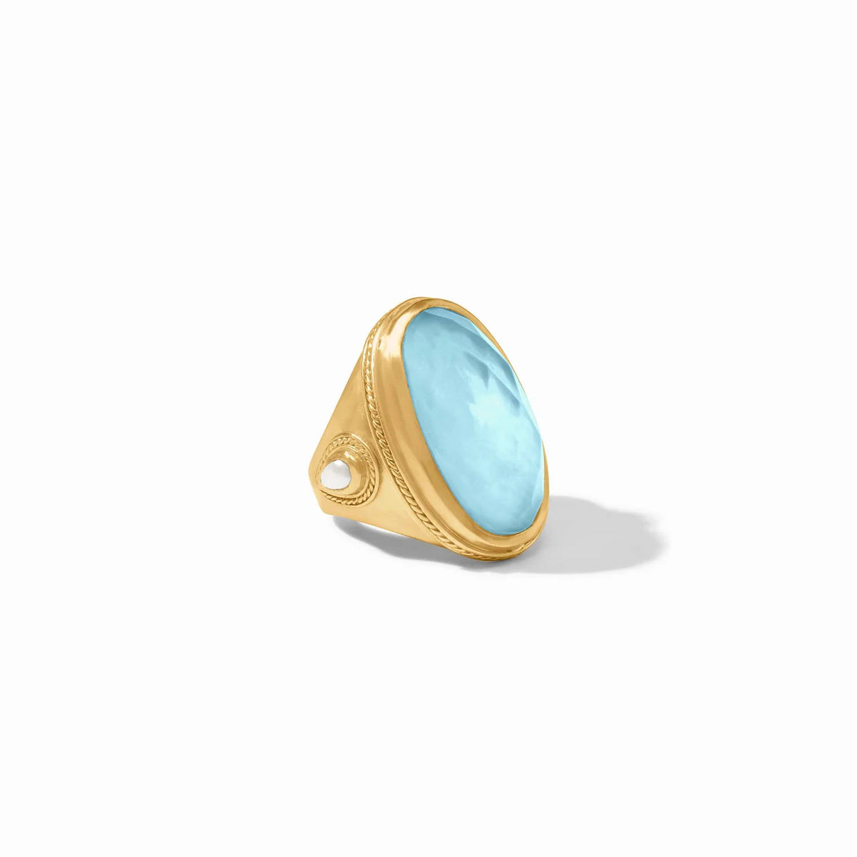 Gold-plated Cannes statement ring featuring a pear-shaped gemstone, mother-of-pearl accents, twisted wire details, and freshwater pearls.