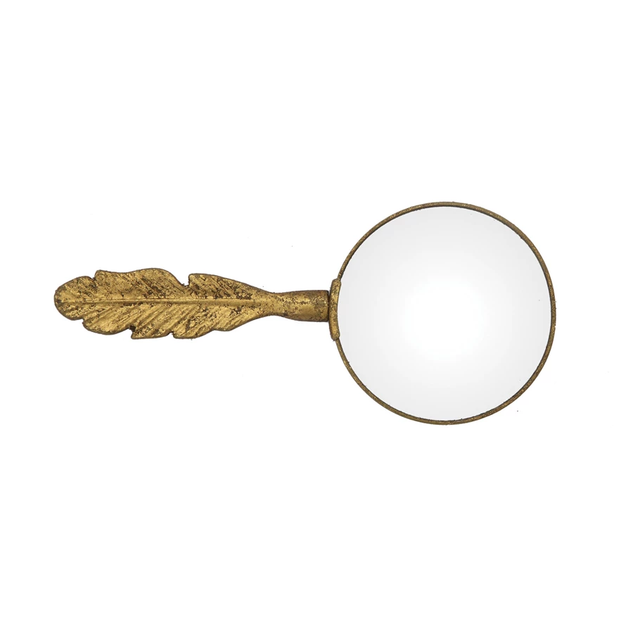 Pewter magnifying glass with feather handle featuring a gold finish on the frame.