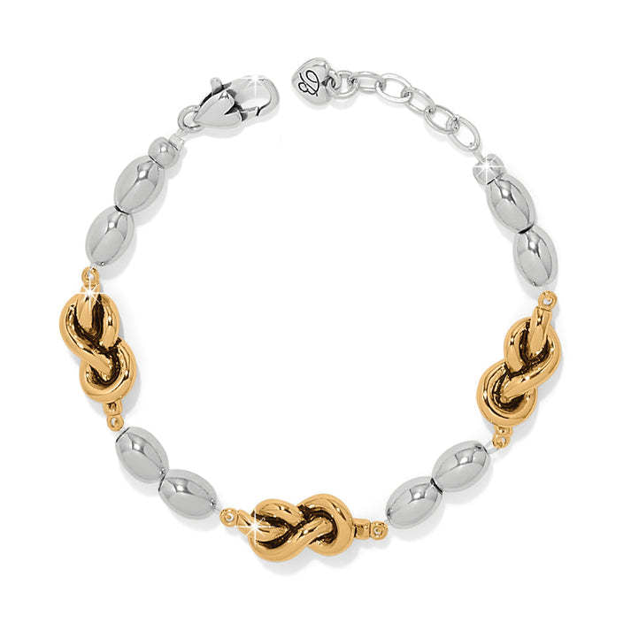 Interlok Single Knot Drops Bracelet with two-tone silver and gold knot links and a lobster closure.