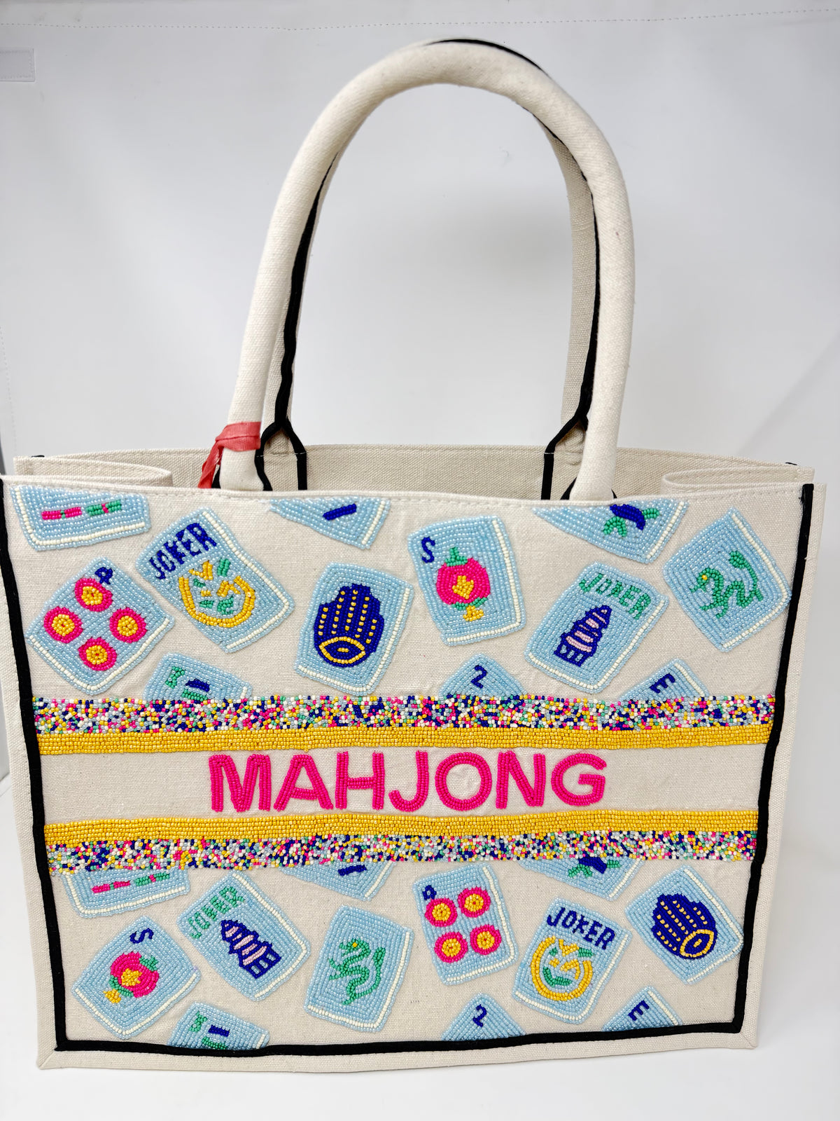 Hand-beaded canvas tote bag featuring blue mahjong tiles and pink beaded "MAHJONG" text.