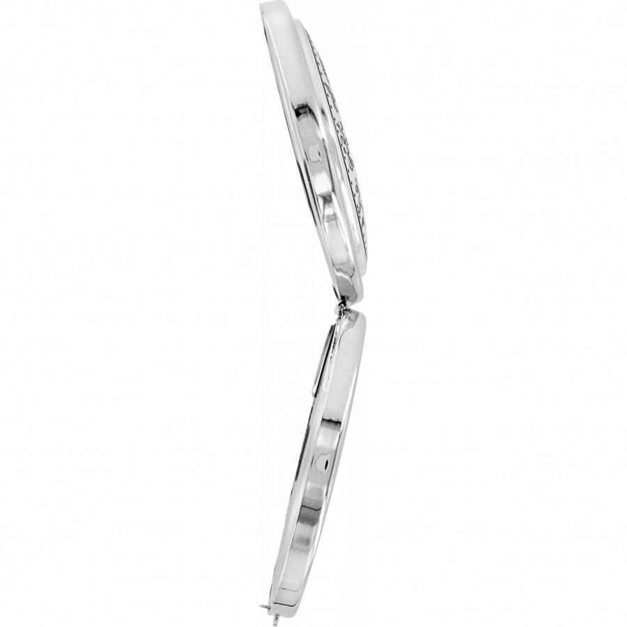 Silver-plated compact mirror with red accents, clasp closure, and side magnification.