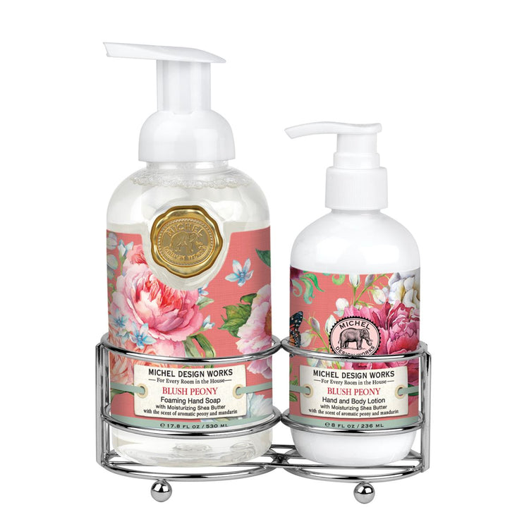 Foaming hand soap dispenser with matching lotion bottle in a neutral caddy.