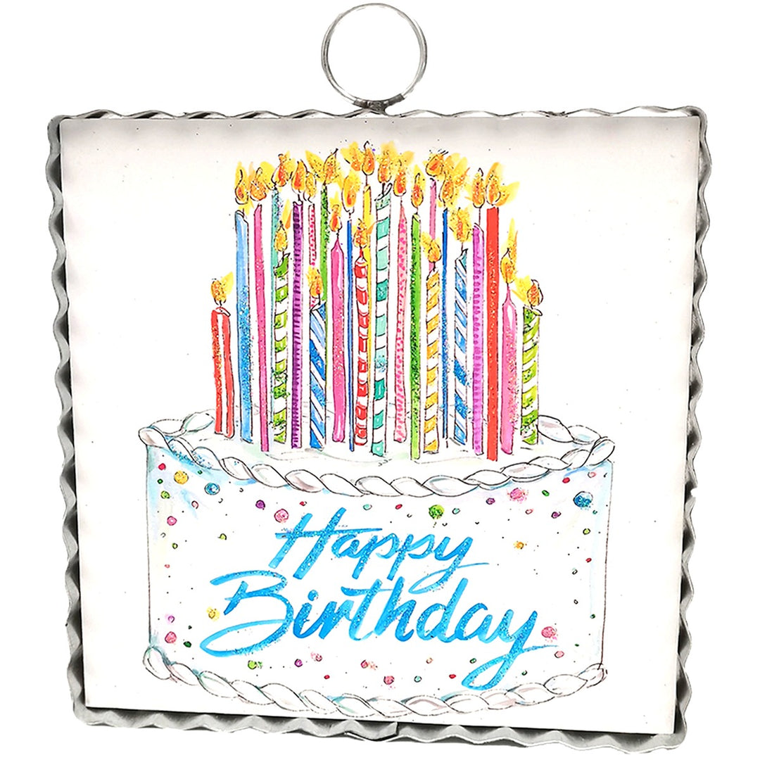 Mini Art Happy Birthday Cake wall hanging with lit candles and a scalloped metal frame.
