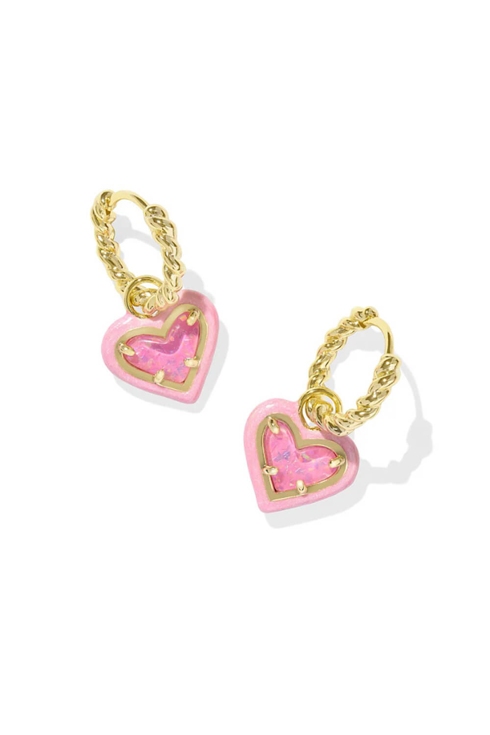 Ari Heart Enamel Frame Huggie Earrings with pink heart charms on gold textured hoops.