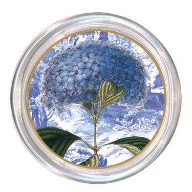 Glass coaster with a high rim to prevent spills and a black velvet back.