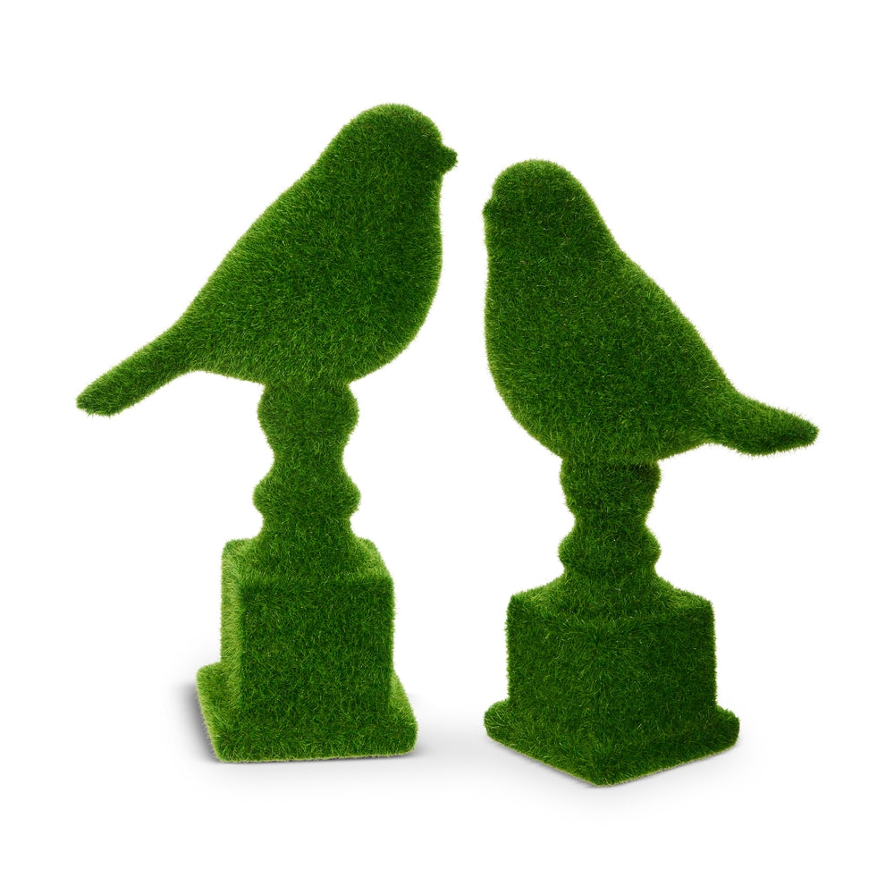 Natural stone powder pedestal featuring a moss green bird perched on top.