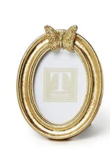 Oval gold leaf finish photo frame with a decorative butterfly detail at the top.