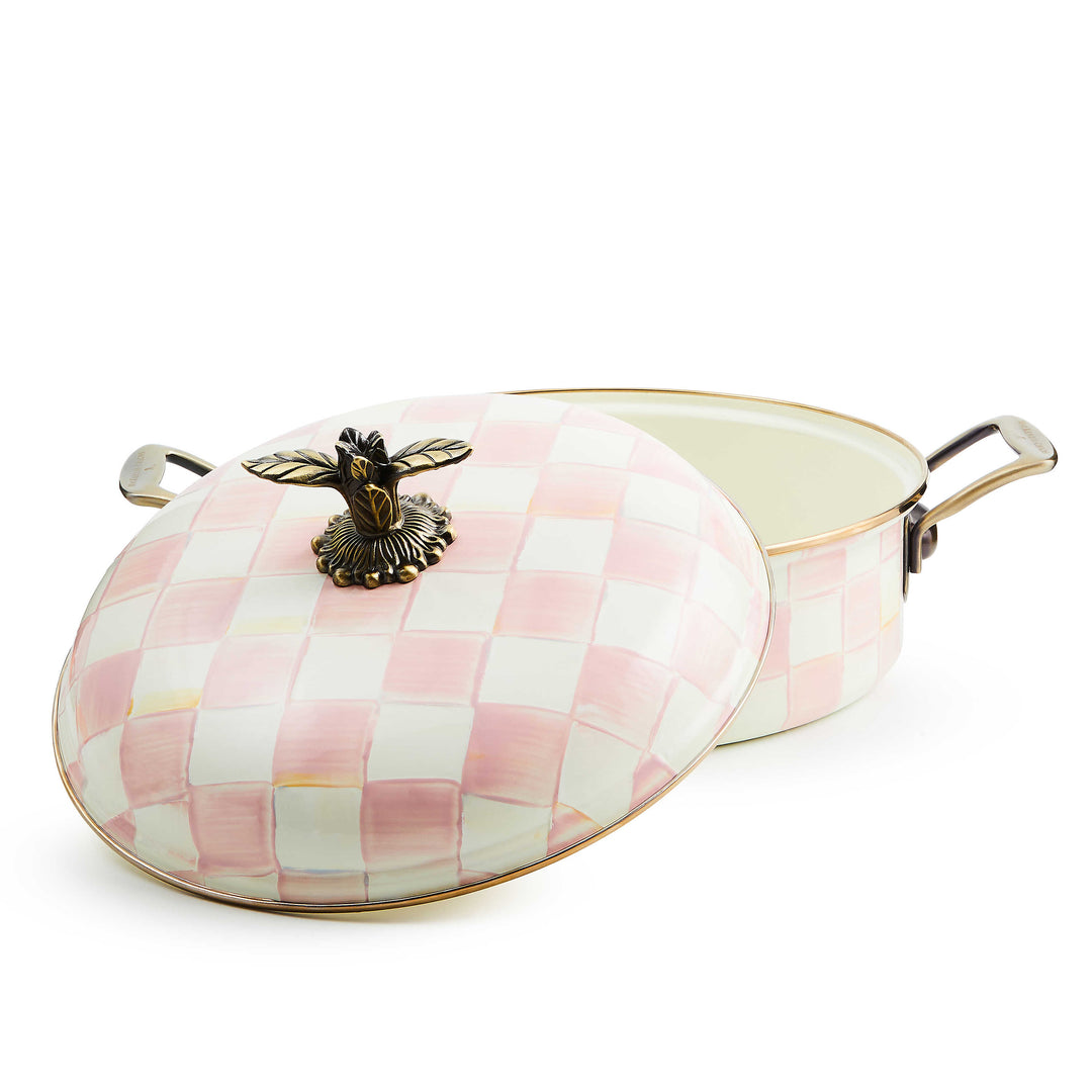 Rosy Check 5 Qt. Casserole with hand-painted pink and white checks and a decorative brass knob.