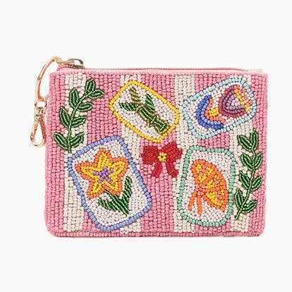 Pink and white striped beaded coin pouch with mahjong tiles, floral, and bow designs.