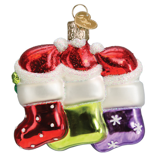 Snow Family of 3 glass ornament featuring three colorful stockings with glittery red hats.