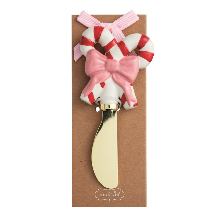 Whimsy Christmas spreader with a hand-painted candy cane and pink bow handle on a gold blade.