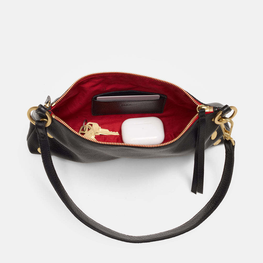 Black brushed gold Kyle bag with red zipper detail shown in front view.