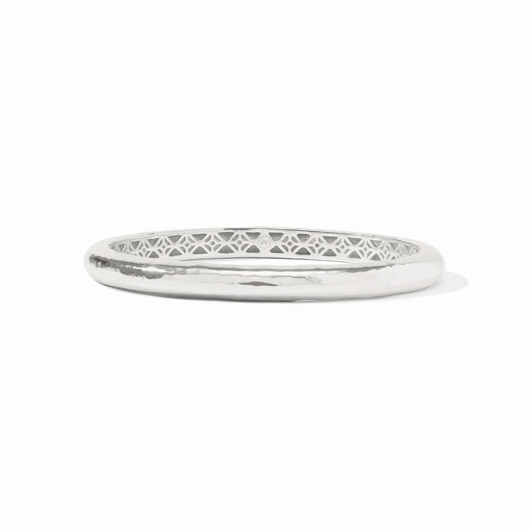 Havana bangle in gold-tone metal with a lightly hand-hammered finish and ornate geometric piercework interior.