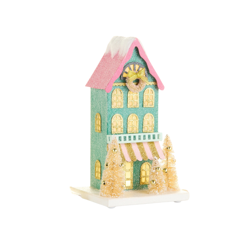 Lighted multicolor paper house with pink roof, teal walls, and gold glitter accents.