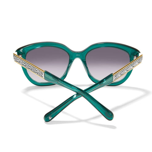 Emerald green round sunglasses with silver-plated decorative accents on the temples.