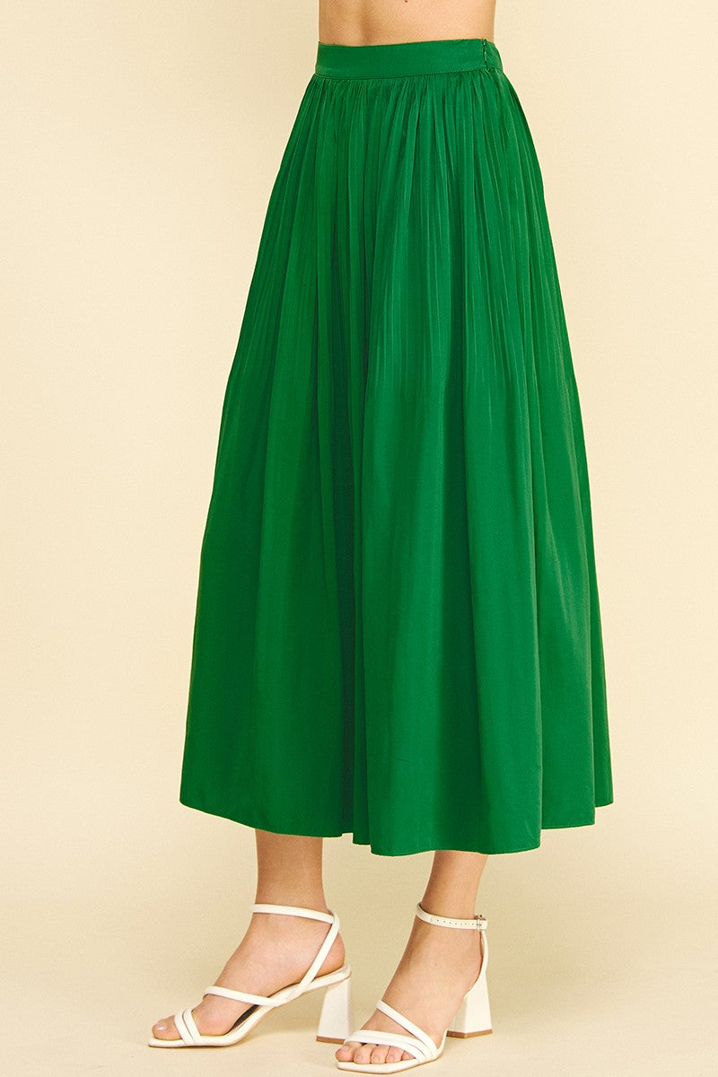 Maggy pleated A-line midi skirt in black polyester with a flowing silhouette.