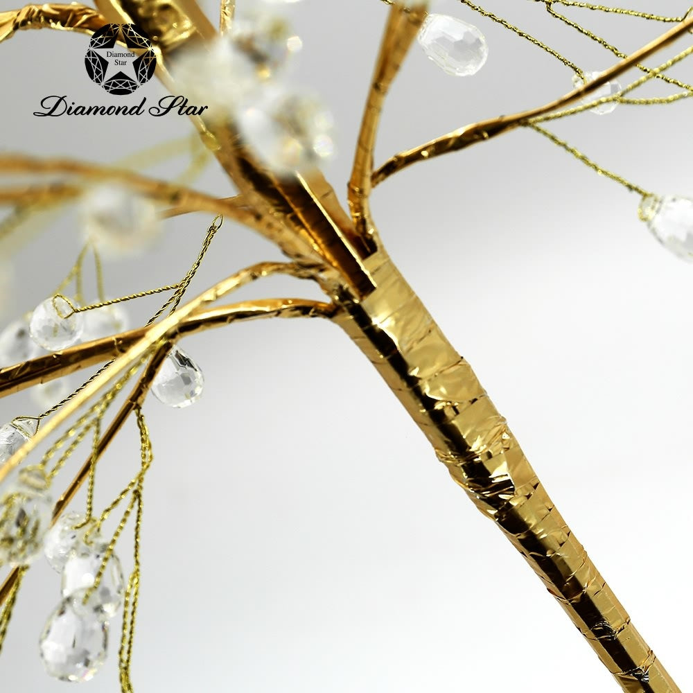 Decorative tree with shimmering branches, crystal accents, gold base