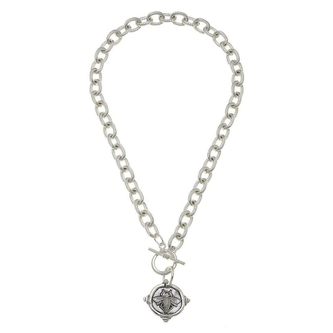 16-inch silver toggle necklace with a textured link chain and a round bee intaglio pendant.