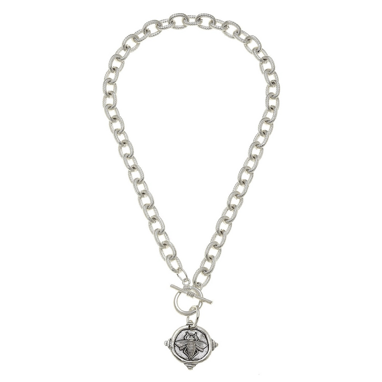 16-inch silver toggle necklace with a textured link chain and a round bee intaglio pendant.