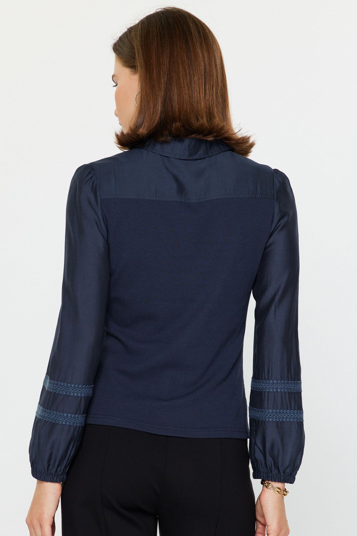 Abigail mixed media polo knit top in soft neutral tone with woven sleeves, lace shoulder trim, and half-button placket.