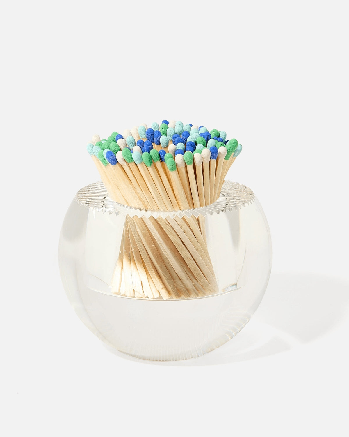 Round clear glass match striker filled with blue and green tipped wooden matches.