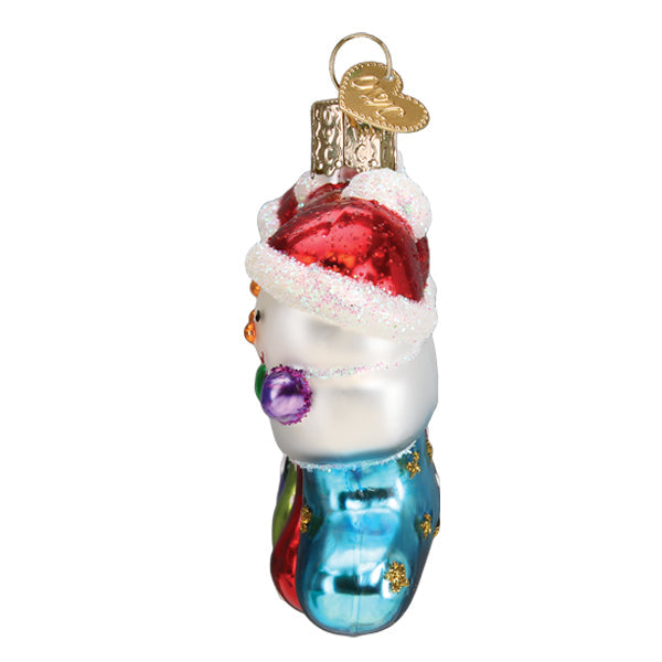 Side view of a glass Snow Family of 4 ornament featuring snowmen in a blue glittery stocking.