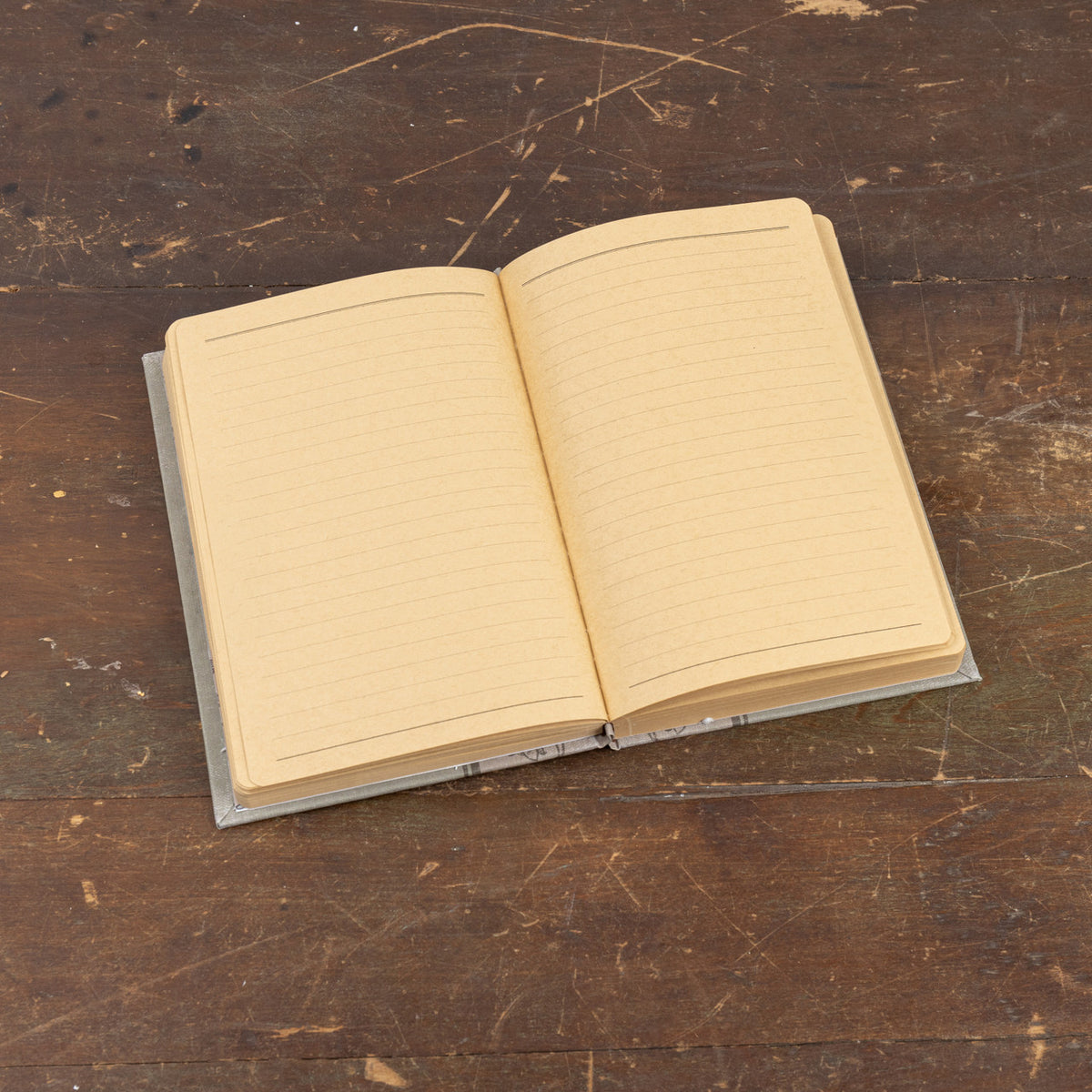 8.5-inch Wildlife in the Meadows journal with a nature-inspired cover pattern.