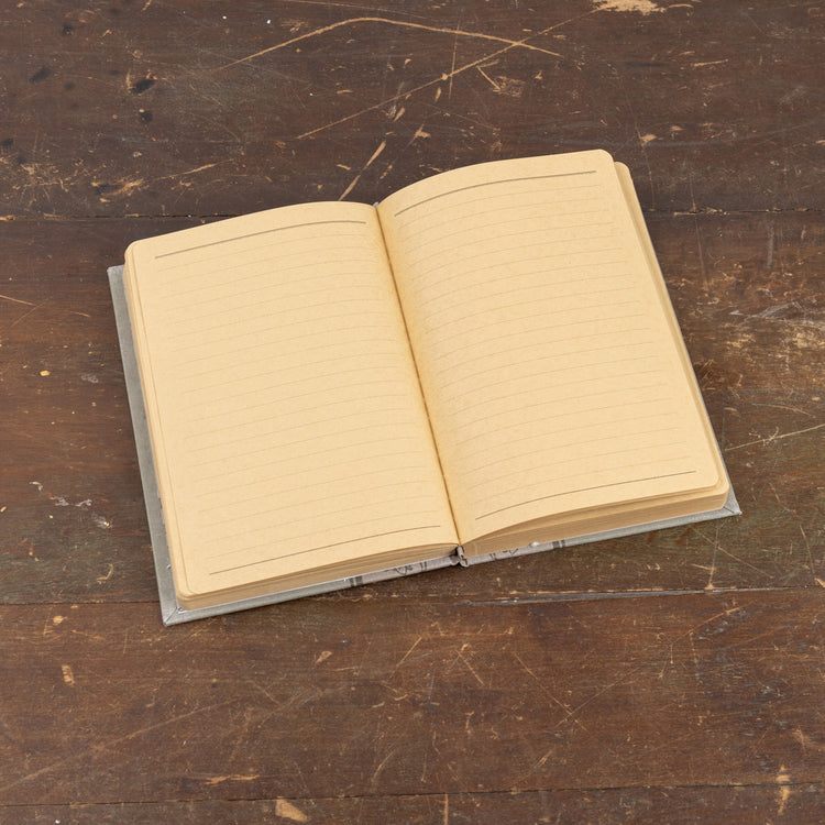 8.5-inch Wildlife in the Meadows journal with a nature-inspired cover pattern.