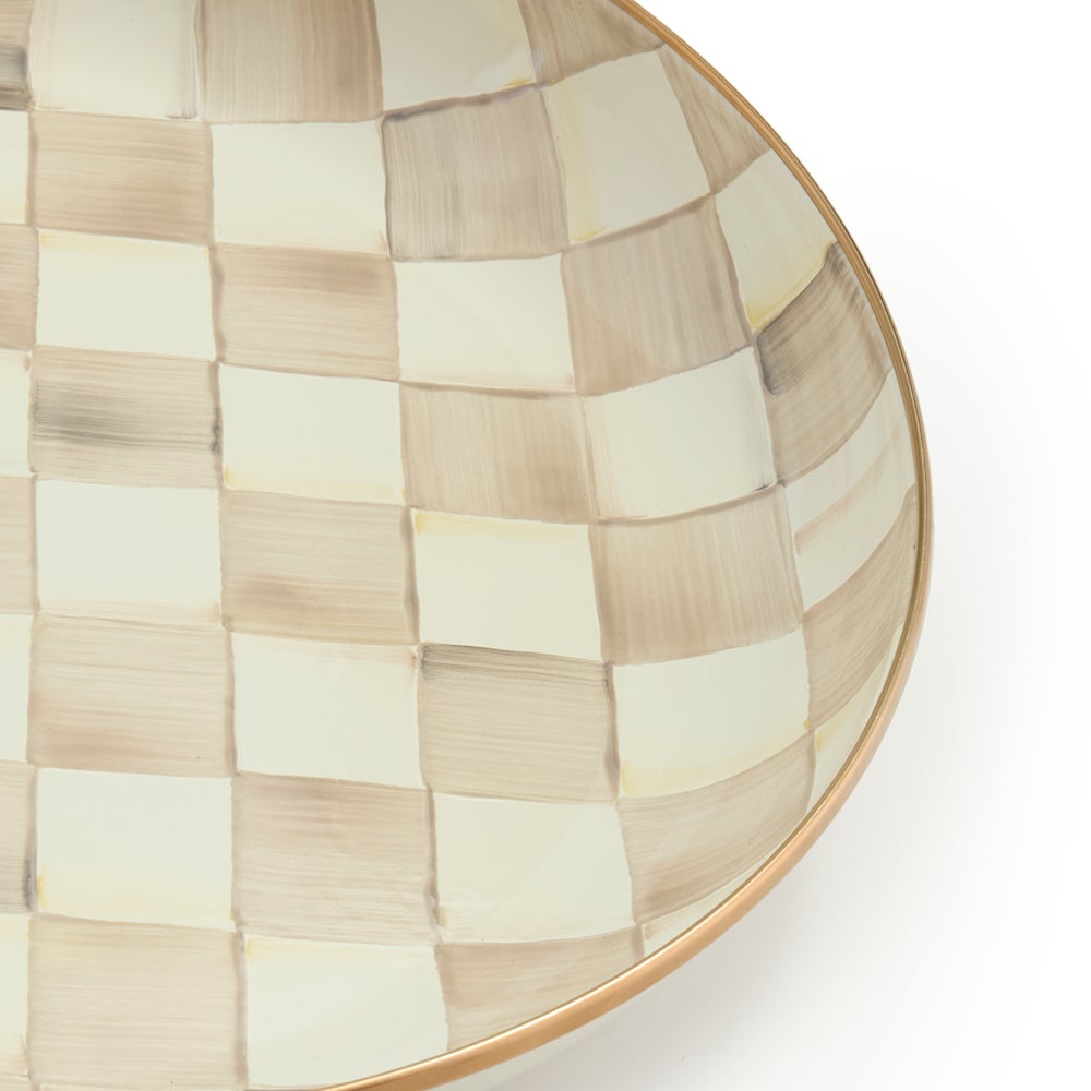 Hand-glazed steel abundant bowl with mocha checkered pattern and bronzed stainless rim