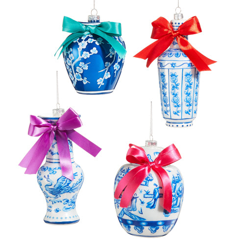 Set of four blue and white chinoiserie glass ornaments with colorful satin bows.