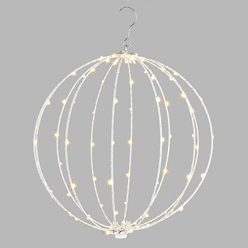 Copper and iron lighted orb with white frame containing warm white LED lights.