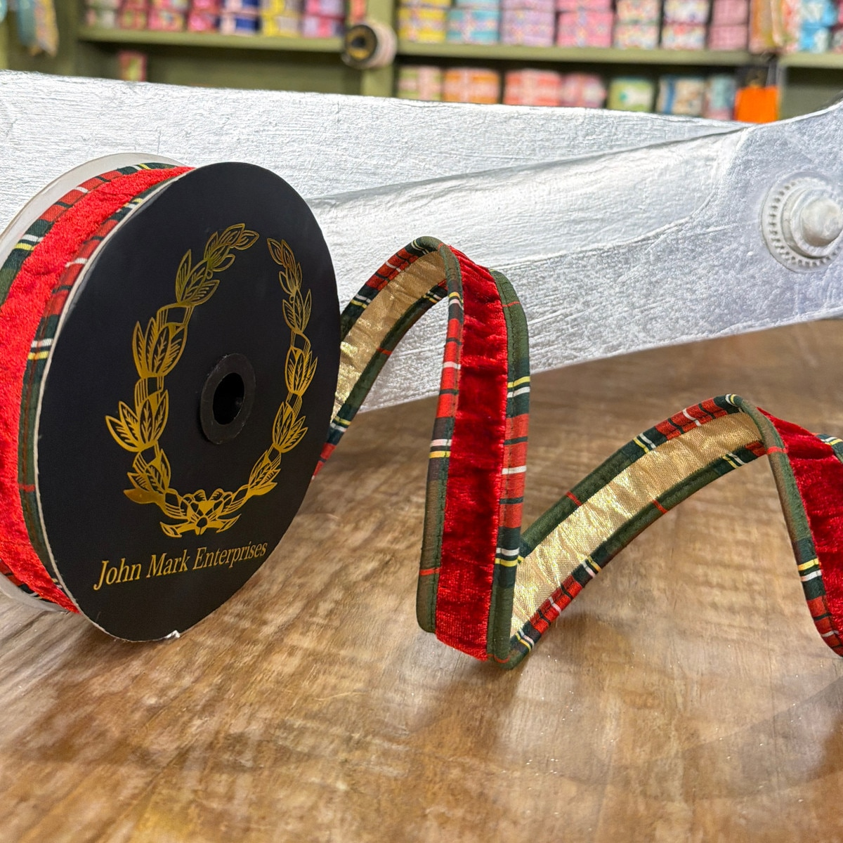 1x10yd Red Velvet Metallic Dupion Plaid Piping Ribbon on a black John Mark Enterprises spool.