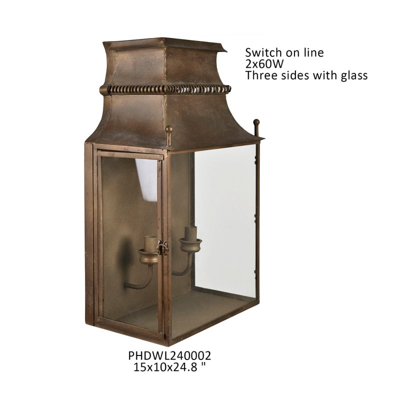 Gate House Wall Lantern in aged gold iron with three glass sides and two candle-style sockets.