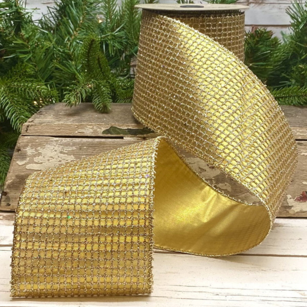 4-inch wide by 10-yard roll of platinum metallic glitter mesh fabric.