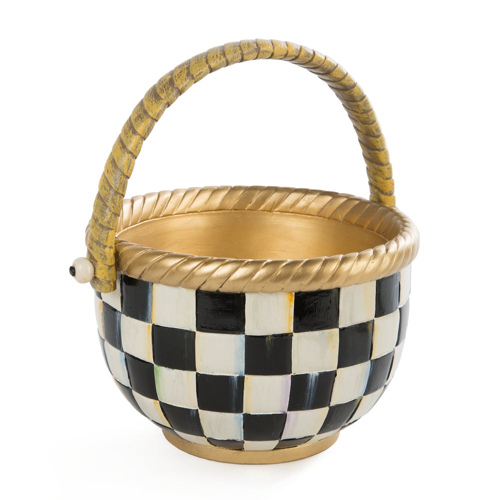 Hand-painted resin basket with a black and white checkered pattern and gold-colored trim and handle.