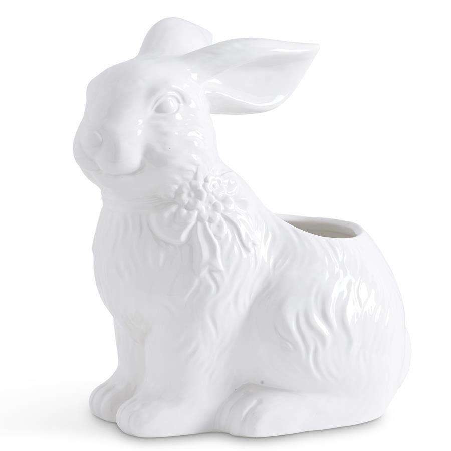 White ceramic planter shaped like a bunny with a bow on its head.