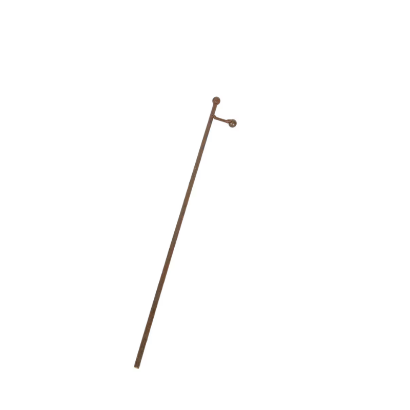 A slender metal stake with a rust finish and a small ball-topped end for displaying decor.
