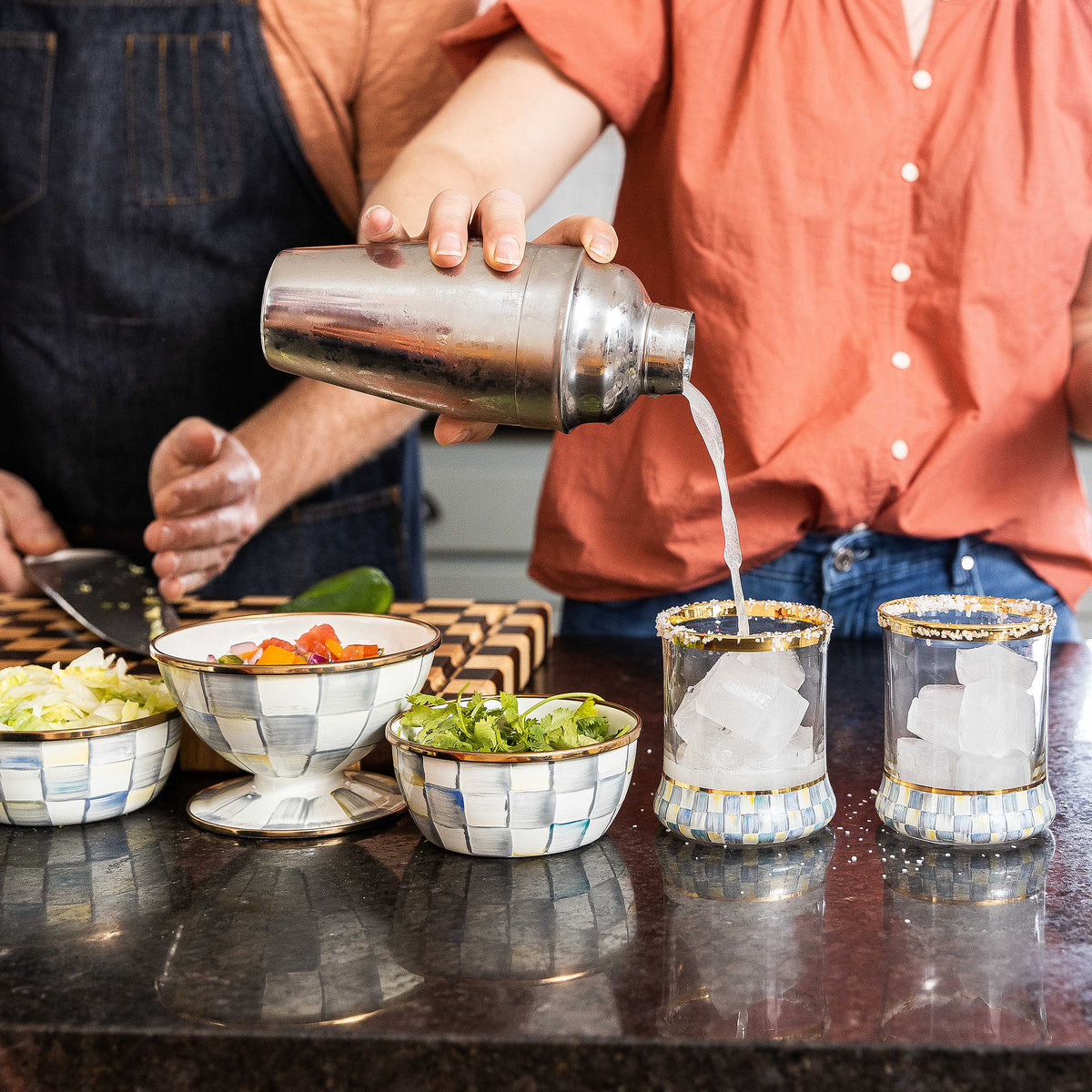 Sterling Check Ice Cream Dish on a counter with salsa, alongside matching bowls and glasses.