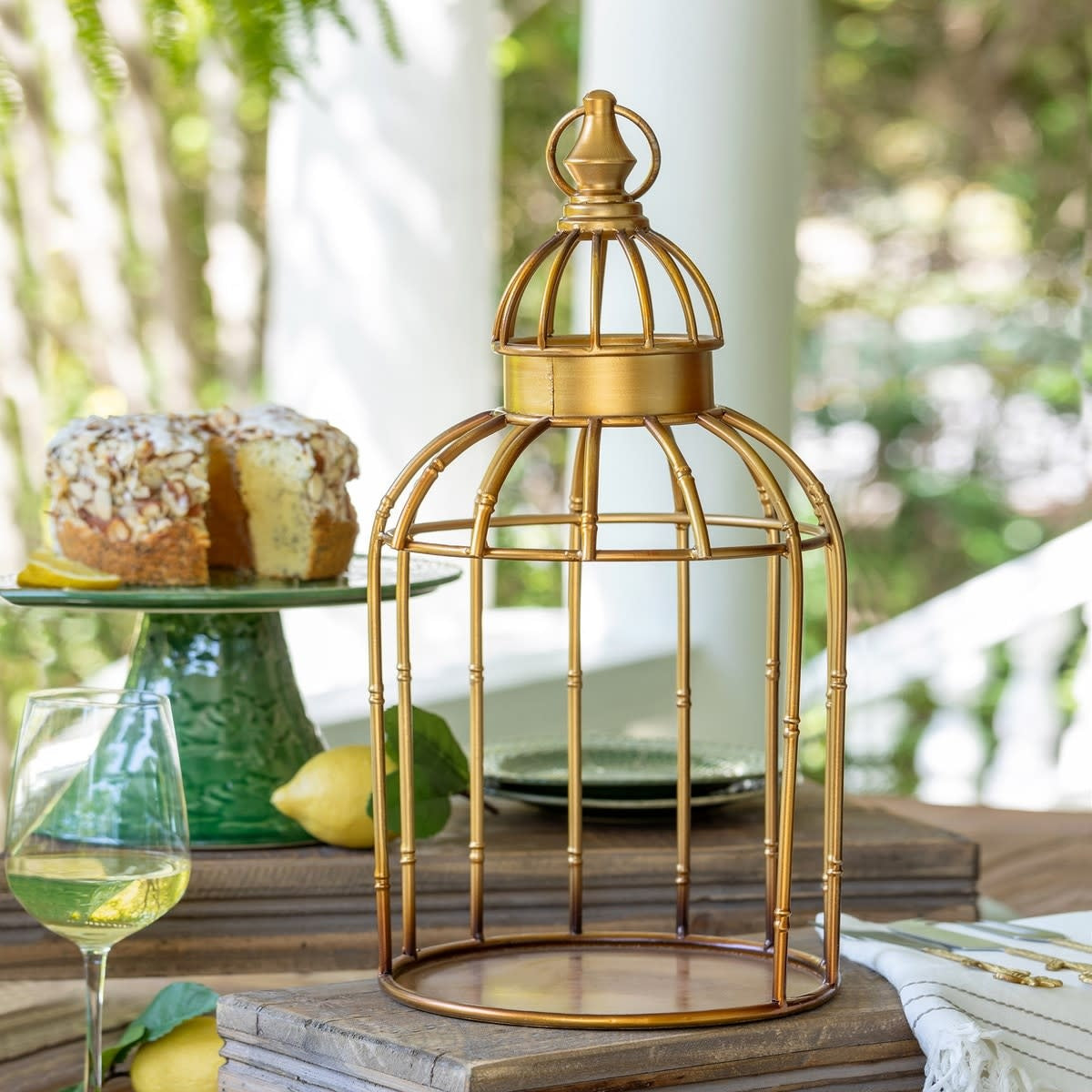 Golden steel hanging bird cage shelf with open geometric frame