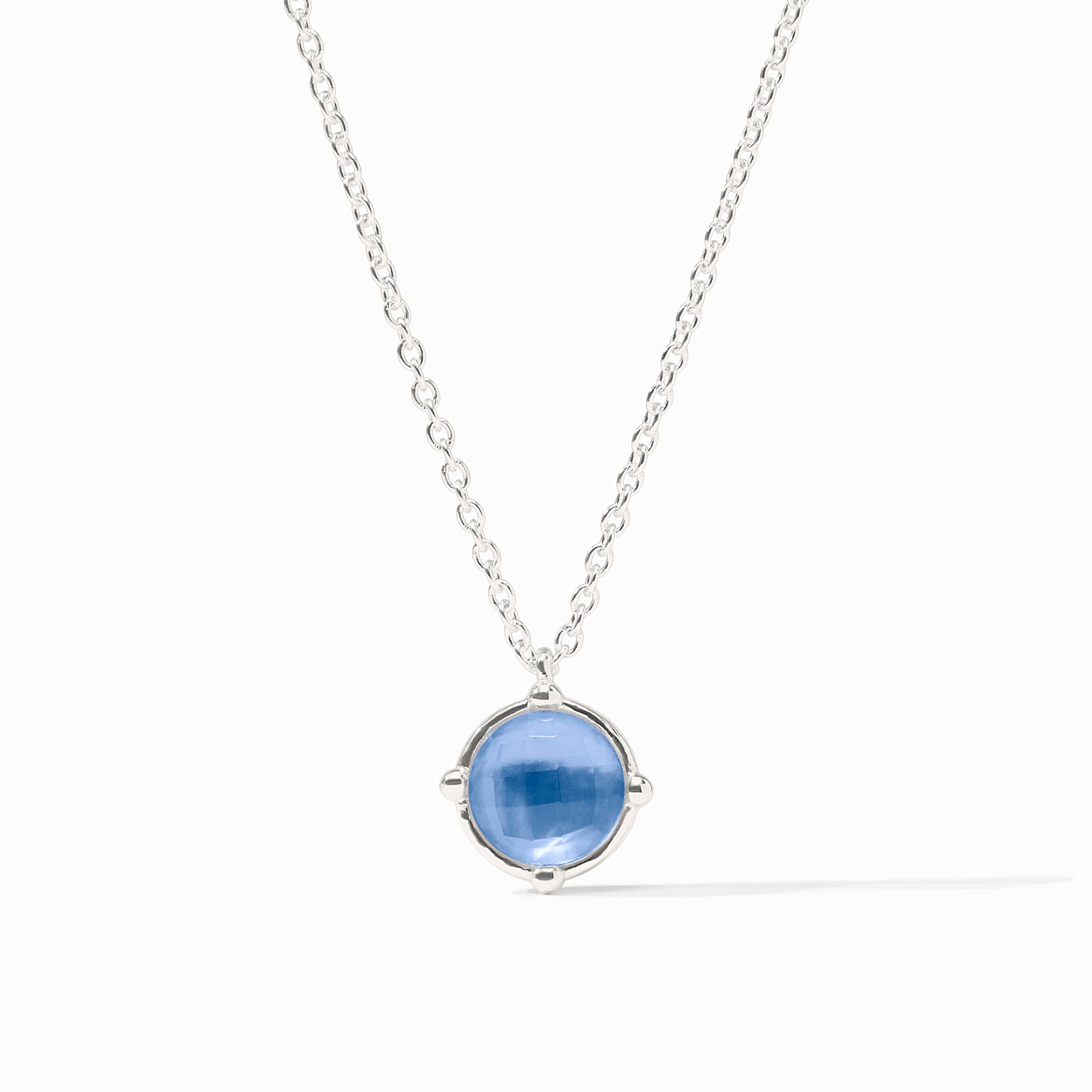 Honeybee Solitaire Necklace in silver with a round blue gemstone pendant on a delicate chain.