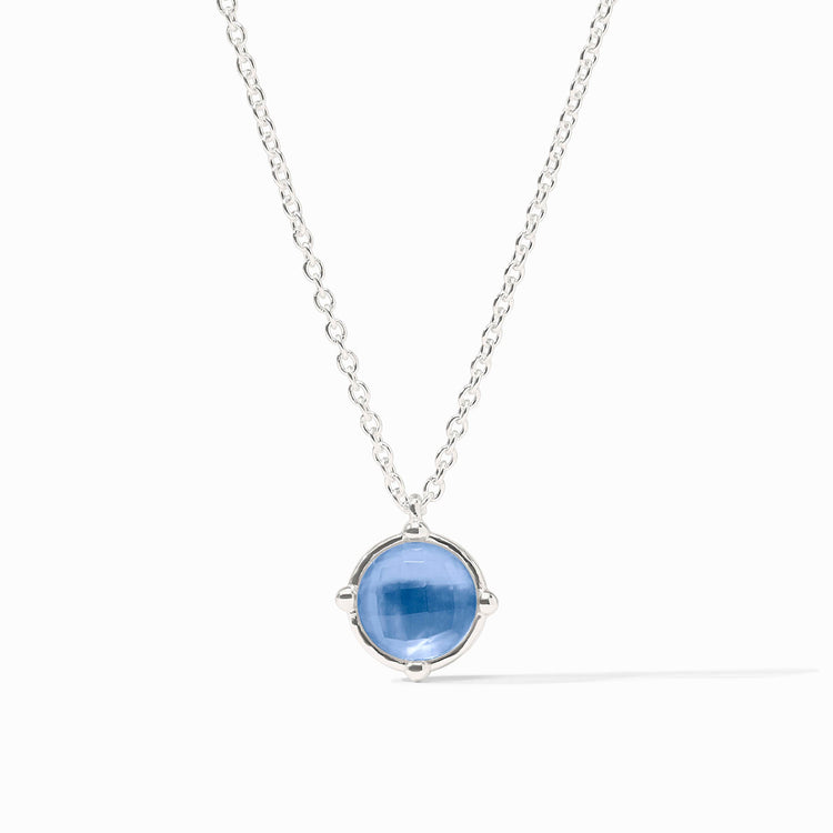 Honeybee Solitaire Necklace in silver with a round blue gemstone pendant on a delicate chain.