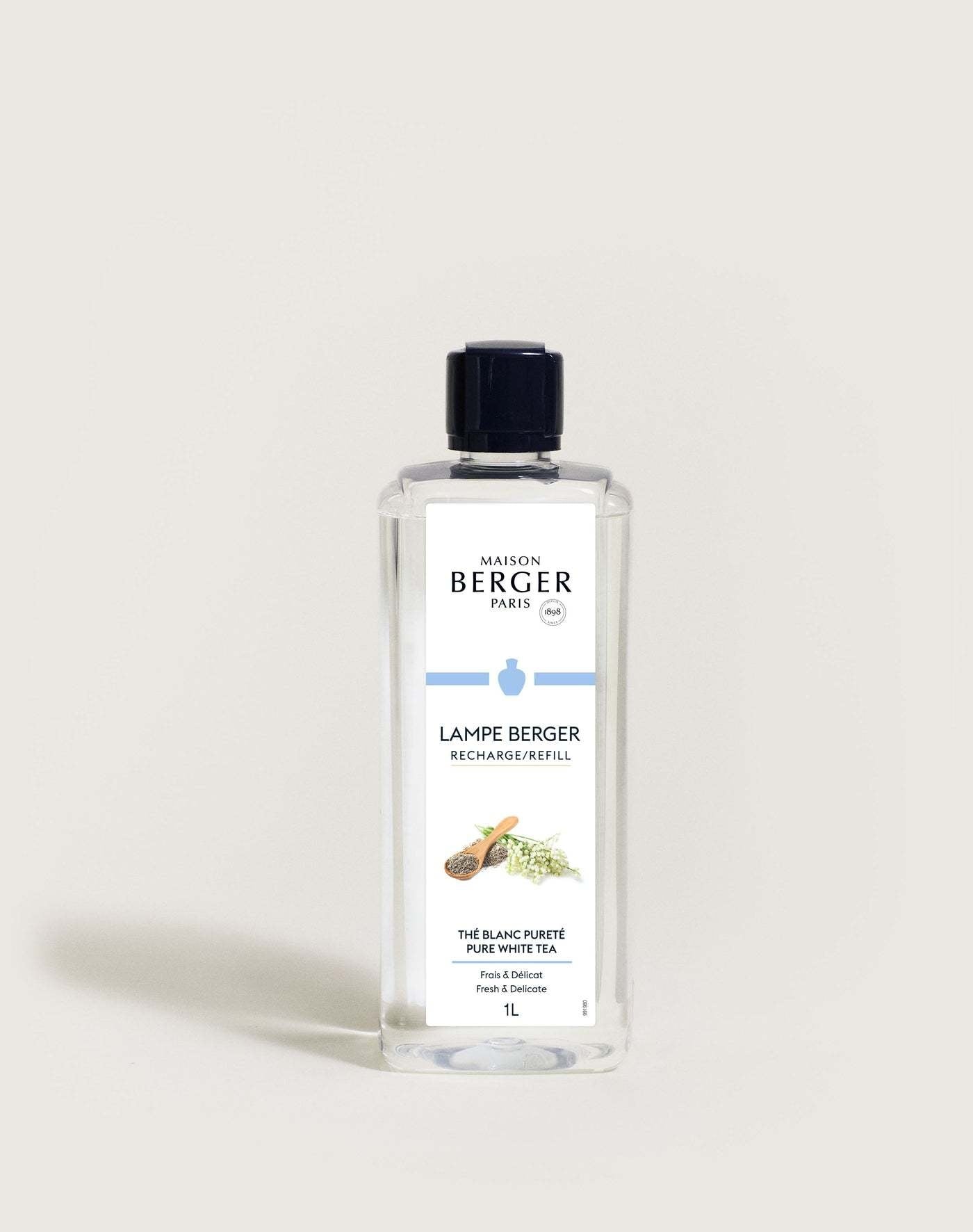 White Lampe Berger refill bottle with Pure White Tea fragrance label