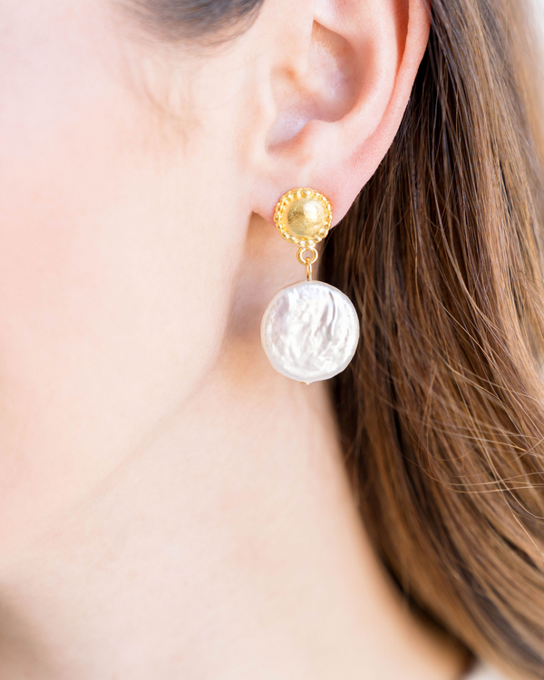 Triple-plated gold drop earrings featuring a large freshwater coin pearl with post backs.
