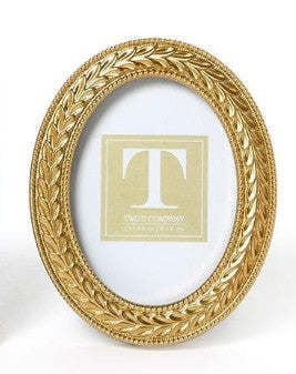 Oval gold resin photo frame featuring an intricate laurel wreath pattern.