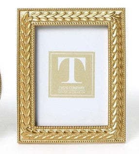 Gold resin photo frame featuring an intricate laurel wreath design with a rectangular silhouette.