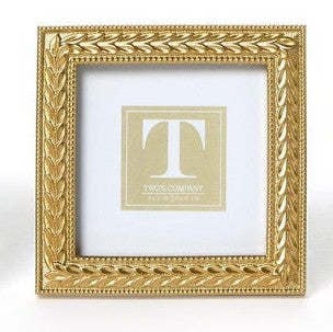 Square gold resin photo frame featuring an intricate laurel wreath pattern.