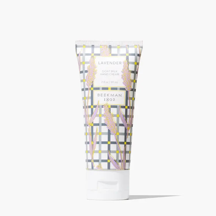 Beekman 1802 lavender goat milk hand cream in a 2oz white tube with a grey and yellow plaid pattern.